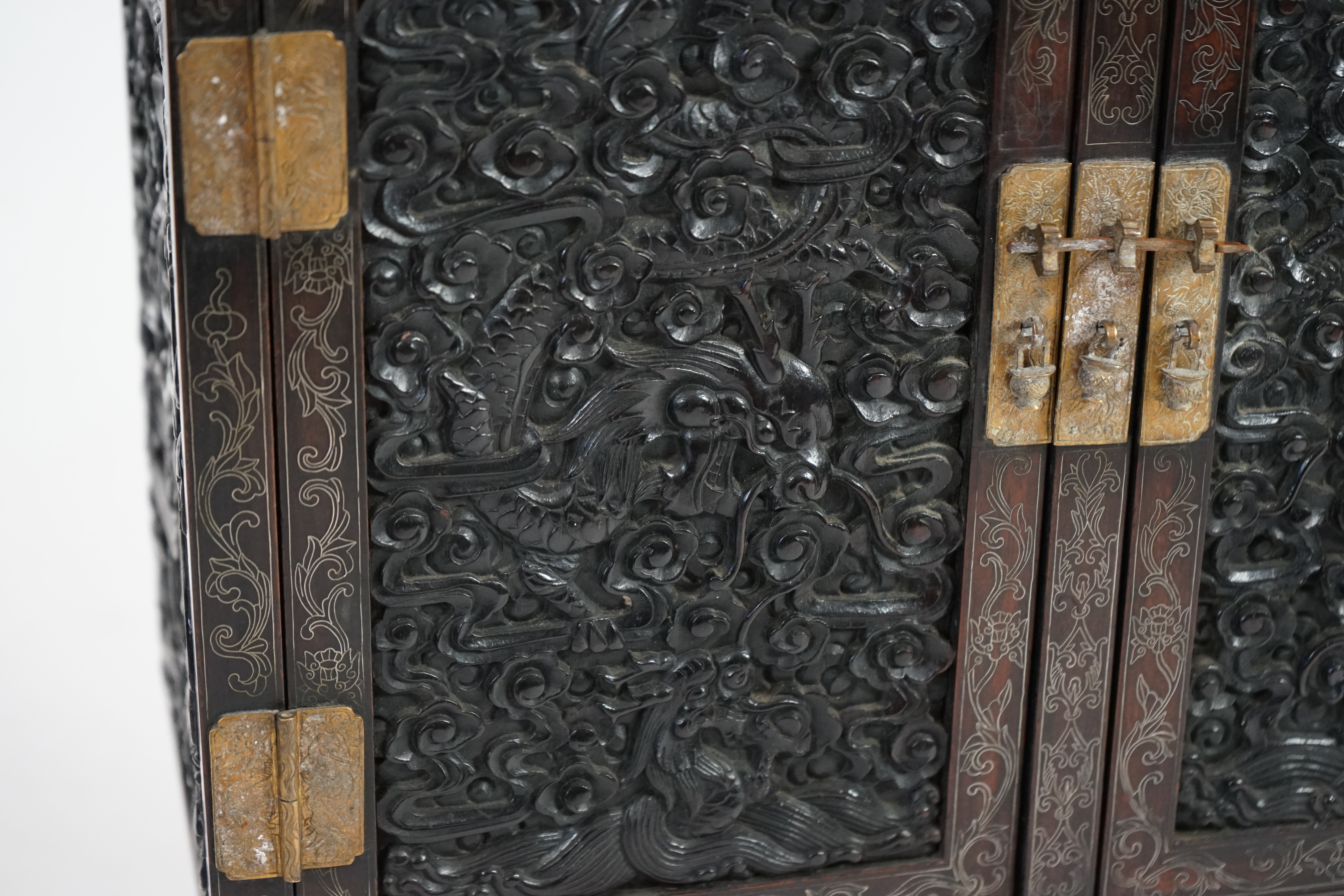 An important pair of Chinese carved zitan and silver wire inlaid ‘cloud and dragon’ curio cabinets and stands, duobaoge, probably Imperial, late Qing dynasty